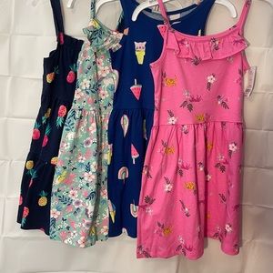 Set of 4 Carters summer dresses. Size 6x. Some new with tags and one worn once.